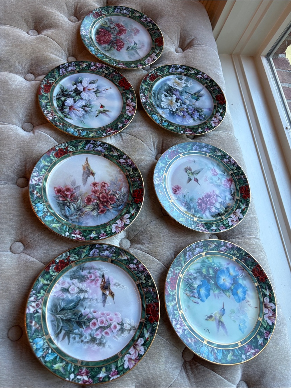 Set of seven Lena Liu porcelain collector plates